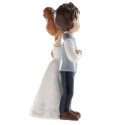 Figura di torta sposa e sposo con fiore rosso