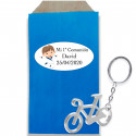 Portachiavi bicicletta argentato in busta kraft con adesivo personalizzato per la comunione del bambino