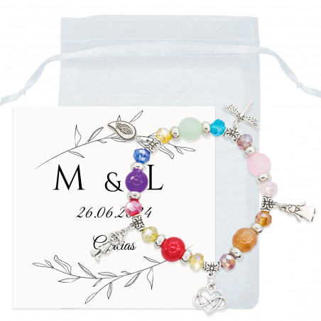 Bracciale con perline colorate e ciondoli in un sacchetto di organza con un biglietto di ringraziamento per i dettagli