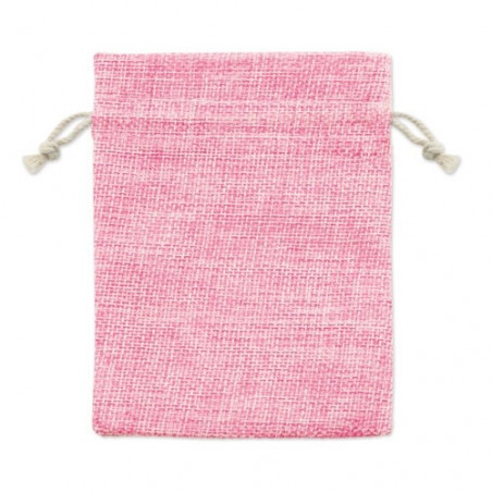 Bracciale con perline colorate e charms in una borsa di stoffa rosa e adesivo speciale per battesimo