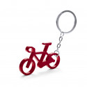 Portachiavi bicicletta rossa e bonbon di cioccolato in una scatola rossa personalizzata per un matrimonio o un dettaglio di San