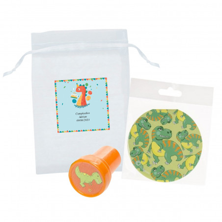 Timbro con dinosauro e quaderno in sacchetto di organza con adesivo coordinato per il compleanno