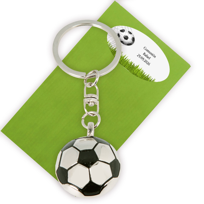 Portachiavi a forma di pallone da calcio presentato in busta verde e adesivo con testo