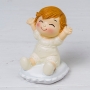 Figura baby pop e divertente sitting on cushion